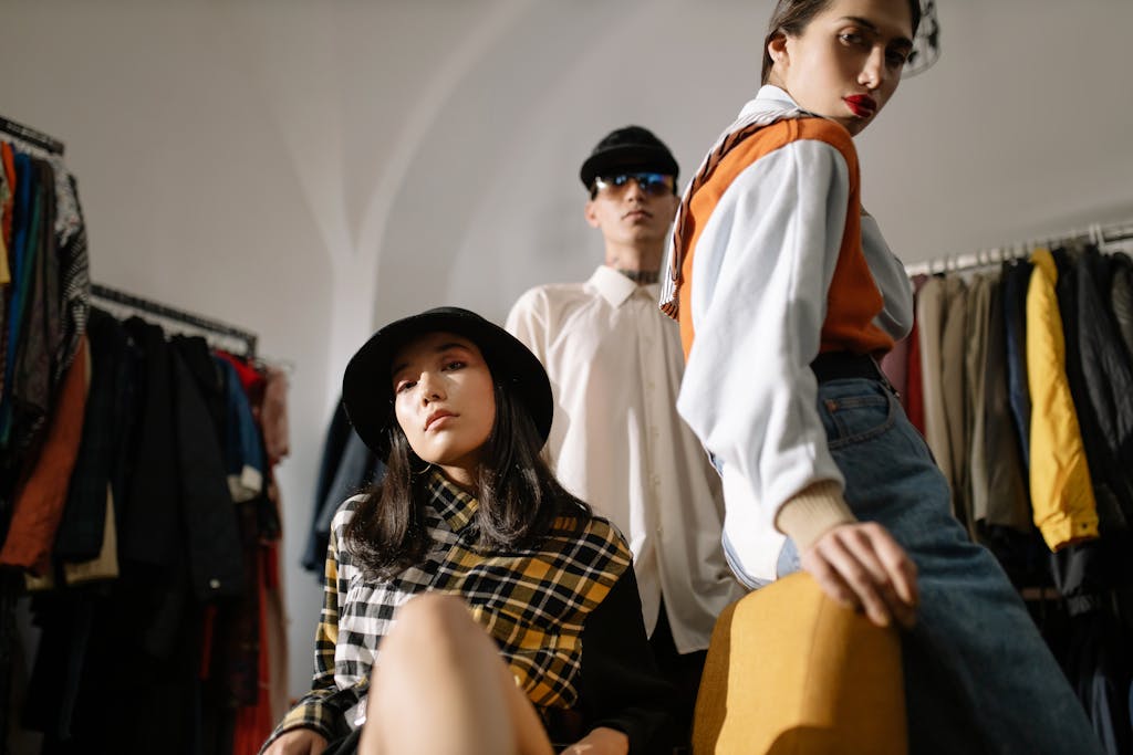 Stylish young models posing in a modern fashion boutique setting.